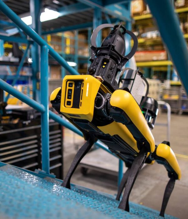 Spot® - The Agile Mobile Robot from Boston Dynamics surveying a manufacturing job site. This autonomous robot can automate sensing and inspection, capture limitless data, and explore tough terrains. 