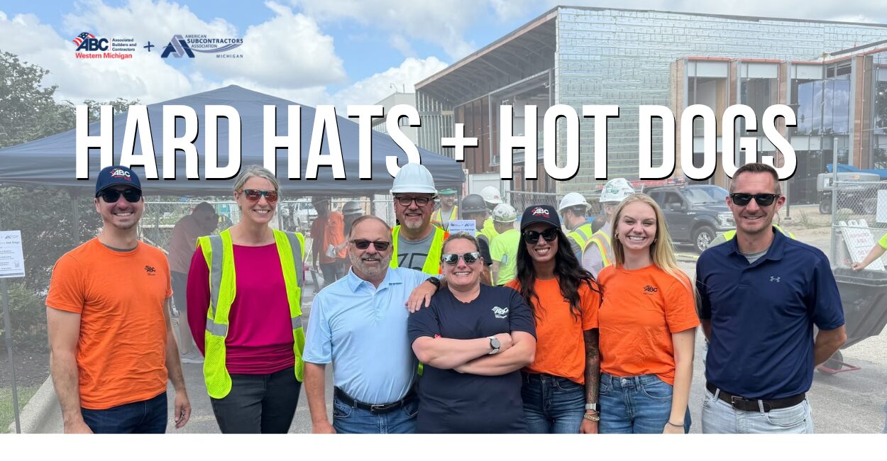A group of ASAM members, ABC West Michigan staff, and work crews enjoy hot dogs at the Hard and Hot Dogs event.